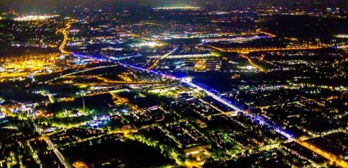 Aerial view, illumination in Schalke blue, Schalke 04, Kurt-Schumacher Straße with thyssenkrupp