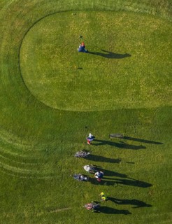 Aerial view, golf course golf club Schloss Horst and golf player on the green in the district Horst
