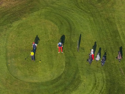 Aerial view, golf course golf club Schloss Horst and golf player on the green in the district Horst