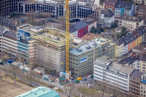 Aerial view, construction site, new building complex with residential tower and senior citizens'