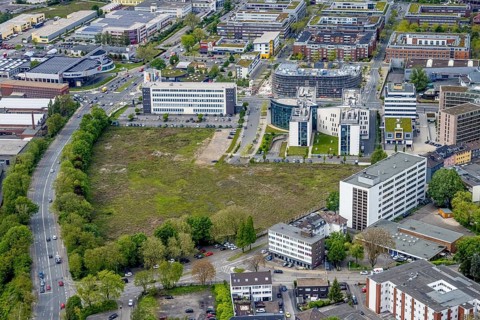 Aerial view, brownfield Schwanenkampstraße, construction site and new office building at the corner