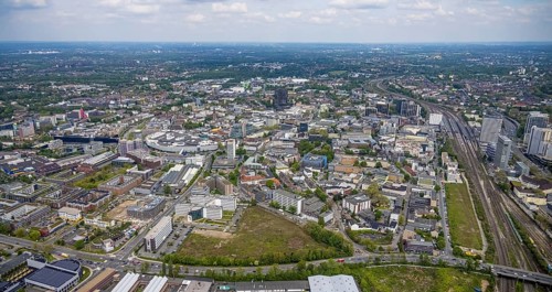 Aerial view, brownfield Schwanenkampstraße, construction site and new office building at the corner
