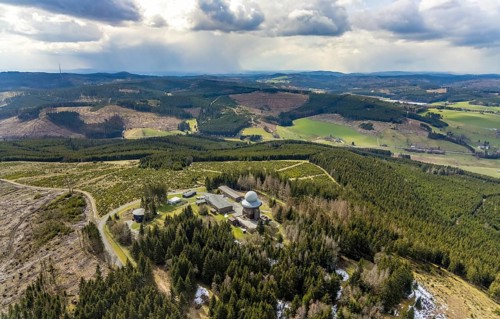 Aerial view, forest damage in a restricted military area, radar dome and radar station on Mount
