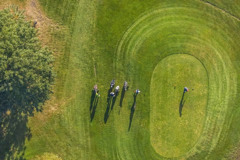 Aerial view, golf course golf club Schloss Horst and golf player on the green in the district Horst