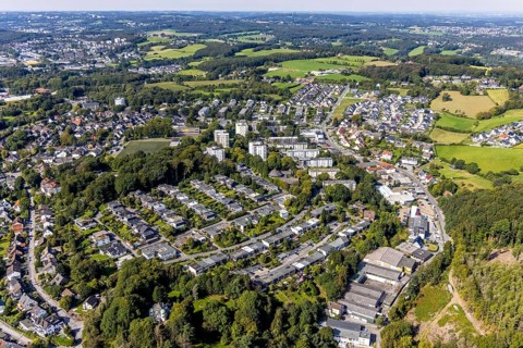 Aerial view, commercial area at Hembecker Talstraße and housing estate Büttenberger Straße in the