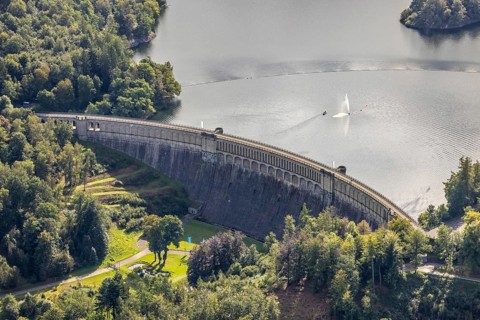Aerial view, Ennepetalsperre with dam wall and boat with water fountain in the district