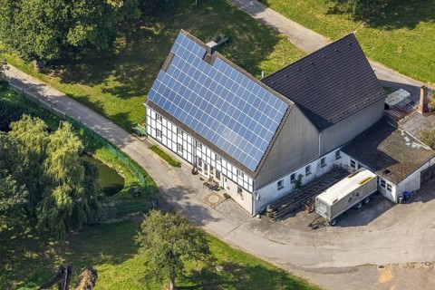 Aerial view, half-timbered house with solar roof in Oberhülsenbecke in the district Rüggeberg in
