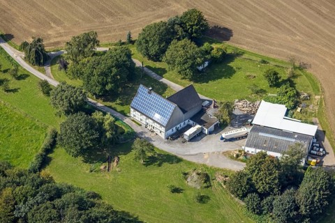 Aerial view, half-timbered house with solar roof in Oberhülsenbecke in the district Rüggeberg in