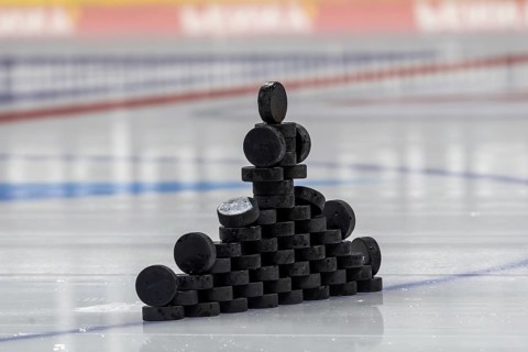 Symbolic picture DEL (German Ice Hockey League) : Close-up of pucks stacked on the ice for play-in