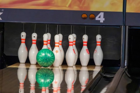 Bowling: Ball rolls towards the bowling pins