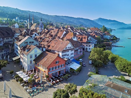 Old town with the Landsgemeindeplatz surrounded by street cafés and restaurants, behind the