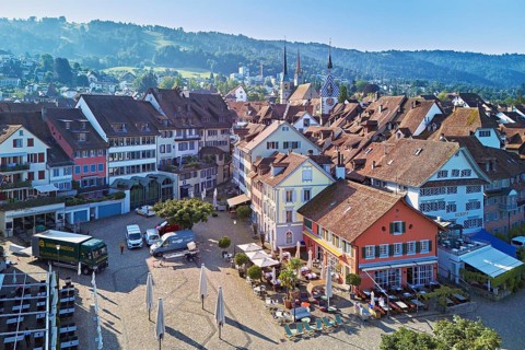 Old town with the Landsgemeindeplatz surrounded by street cafés and restaurants, behind the