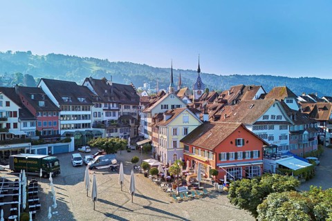 Old town with the Landsgemeindeplatz surrounded by street cafés and restaurants, behind the