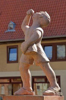 Juice boy at the market fountain, symbolising the historical supply of drinking water, boy