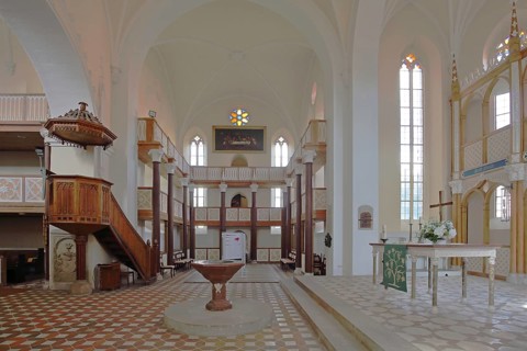 Chancel, baptismal font, pulpit with pulpit bonnet, gallery, interior view of the neo-Gothic St