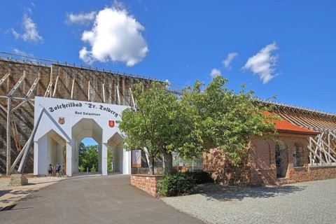 Portal to the spa gardens through the graduation tower, entrance, archway, inscription, Tolberg,