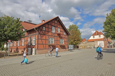 Volksbank building, half-timbered house, historic Hague Gate, pedestrians, cyclists, Haldensleben,