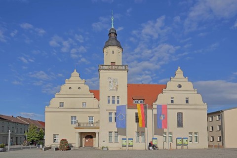 Renaissance town hall with EU flag, German national flag and town flag, three, flags, Coswig,