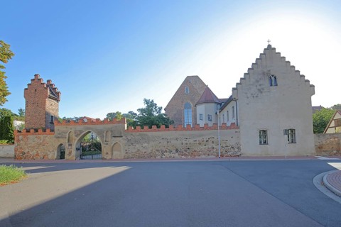 Francisceum built 13th century, former Franciscan monastery, tower with battlements, stepped gable,