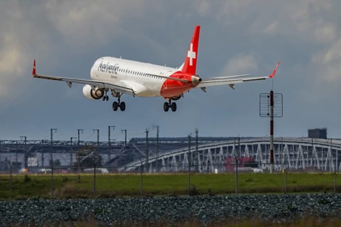Aircraft approaching Stuttgart Airport. Aircraft registration: HB-JVJ, Helvetic Airways, Embraer