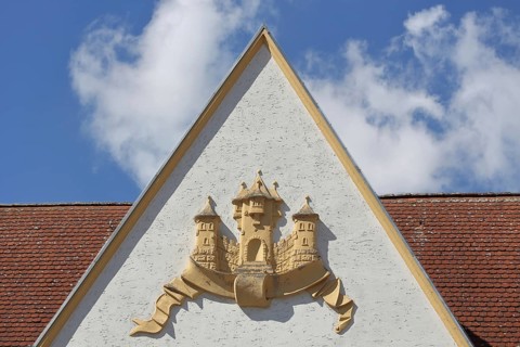 Town coat of arms in relief on the gable of the town hall, Barby, Saxony-Anhalt, Germany