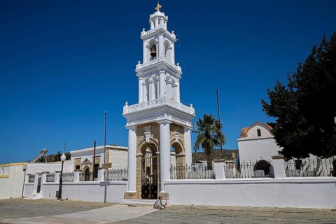 Church of Agia Paraskevi, A magnificent white church tower rises into the clear blue sky, village