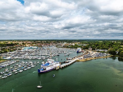 Wight Light car ferry to Isle of Wight on Lymington River and marina from drone, Lymington, New