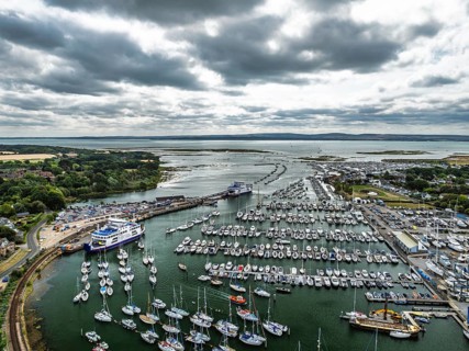 Wight Light car ferry to Isle of Wight on Lymington River and marina from drone, Lymington, New