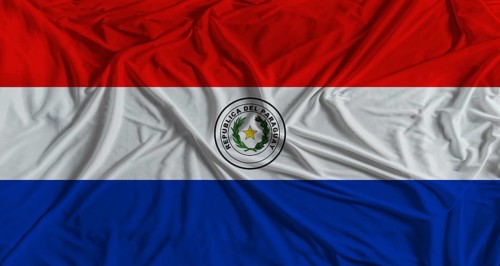 Paraguayan flag with fabric texture background. National flag of Paraguay with cloth texture