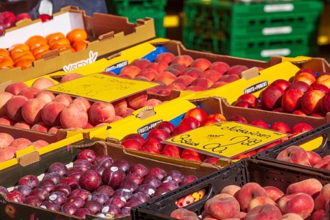 Fresh fruit in crates with price tag on a market stall, Bremen, Germany