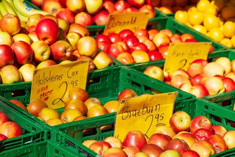 Fresh apples in crates with price tag on a market stall, Bremen, Germany