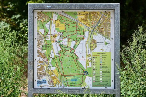 Mannheim, Germany - August 31st 2025: Information sign with map of Dossenwald forest in Mannheim