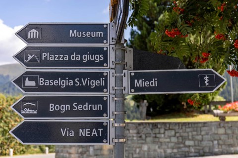 Signpost in the village to the museum, Via NEAT, church, Sedrun, Surselva, Graubünden, Switzerland
