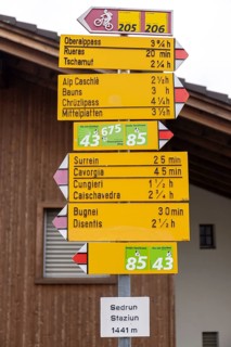 Signpost at the railway station, Staziun Sedrun, Surselva, Graubünden, Switzerland