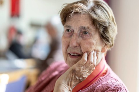 Close-up, authentic, unposed portrait of a 90+ year old senior woman with dementia and Alzheimer's