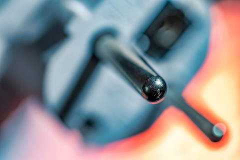 Close-up of a power plug, Schuko plug, with focus on the contact pins, symbol image for,