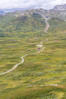 Gravel road through Jotunheimen National Park, view from Smørkollen mountain, Beitostølen,