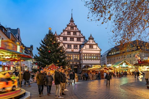 Christmas market at the colourfully illuminated Paderborn Town Hall at duskin Paderborn, North