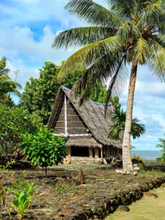 Traditional historical meeting house for men Tribal Chief Men Men's House between palm trees, in