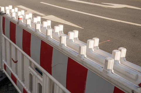 Borken, NRW, Germany, Red and white plastic roadblock closing a lane on an asphalt road during