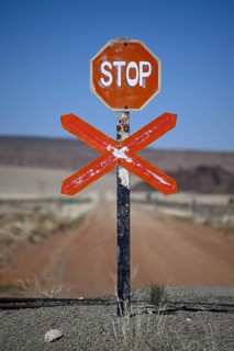 Stop sign at an ungated level crossing on the Lüderitz-Keetmanshoop railway line, near Goageb,