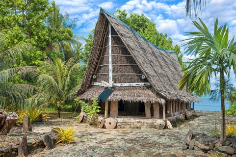 Traditional historical meeting house for men Tribal Chief Men Men's House between palm trees, in