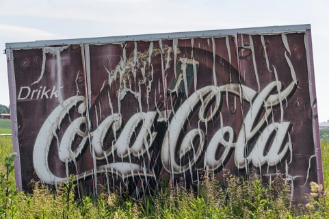 Old advertising sign Drikk Coca-Cola in a field, advertising for Coca-Cola, Jessheim, UIllensaker,