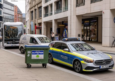 Bus and police vehicle in Großer Burstah, Hamburg, Germany