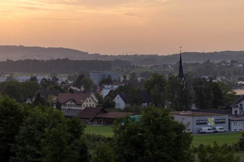 Village view with church and Schiess Ausstattungshaus, Erlen, Thurgau, Switzerland