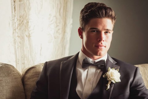 Handsome groom in elegant costume before the weeding waiting to join his bride, AI generated