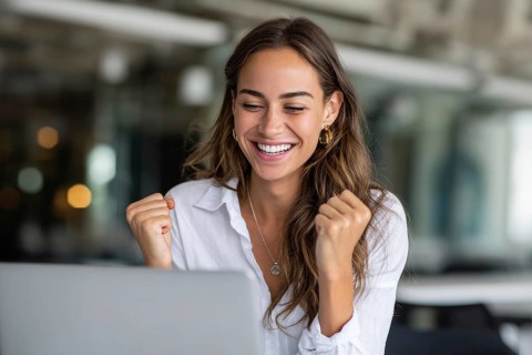 Emotional business woman showing happiness. Concept of winning and achieving corporate goals and