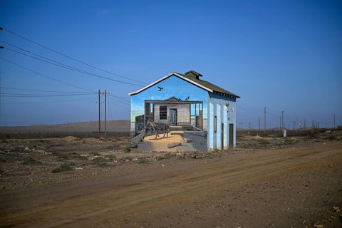 Painted house facade, graffito, brown hyena, diamonds, Oranjemund, Karas region, Namibia