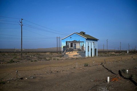 Painted house facade, graffito, brown hyena, diamonds, Oranjemund, Karas region, Namibia