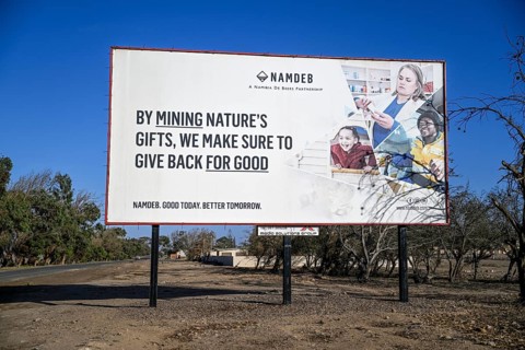 Advertising board of the Namibian diamond company NAMDEB, Oranjemund, diamond restricted area,